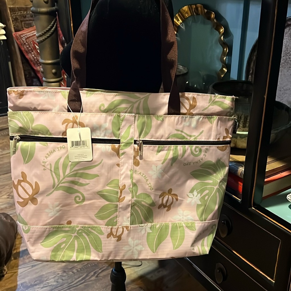 NWT nylon Travel bagfrom Hawaii. 14” tall 18” wide 5” deep with 3 zippers